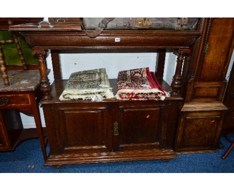 AN EARLY 20TH CENTUIRY MAPLE & CO OAK TWO TIER BUFFET, with a raised back, on Greek style pillar supports above a double cupb