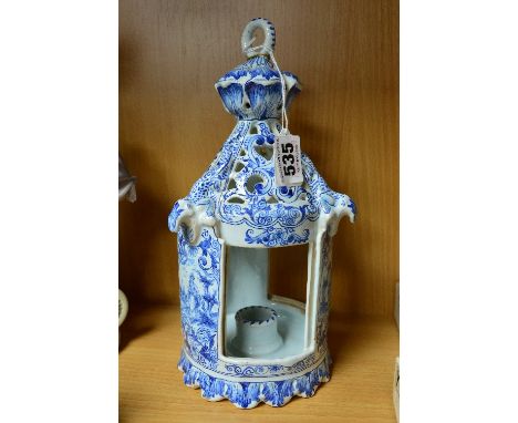 A DUTCH DELFTWARE TABLE LANTERN, ring handle (glued) above a pierced top with moulded lizards, the three open sides with slot