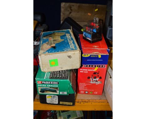 A CHAMPION ROUTER (in box), a Black and Decker sander (in box), a Parkside sander (in box), a Black and Decker circular saw (