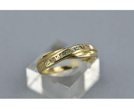 A 9CT CROSSOVER DIAMOND RING, size P, approximate weight 2.0 grams