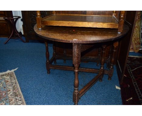 AN OAK GATE LEG TABLE