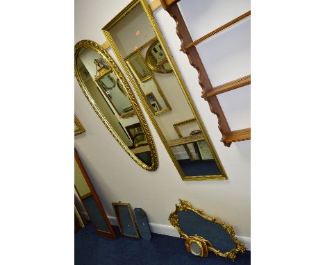 A GILT FRAMED OBLONG WALL MIRROR, two other wall mirrors and a barometer (4)