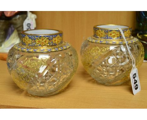 A PAIR OF MOSER BALUSTER VASES, having gilt and enamel decoration to the rim and shoulder over body of cut and clear panels, 