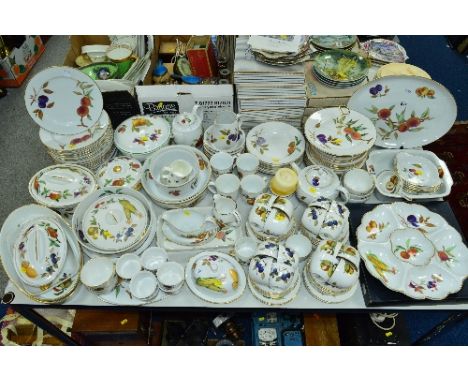 A COMPREHENSIVE ROYAL WORCESTER EVESHAM PATTERN DINNER SERVICE, including sixteen cups and saucers, five covered tureens, var