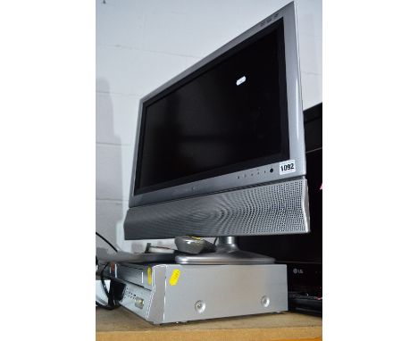 A SHARP 22' LCD TV, and an LG dvd/video recorder (two remotes) (2)