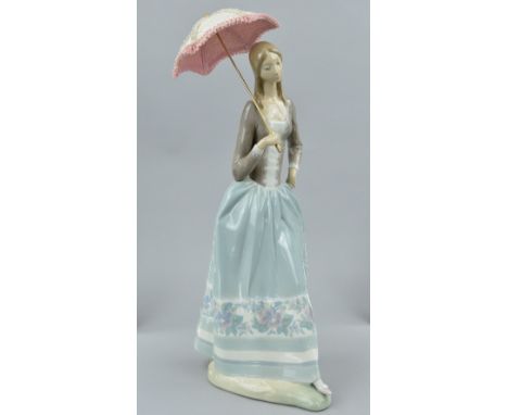 A LARGE LLADRO FIGURINE, young woman holding a parasol, height approximately 46cm (including parasol), together with a box an