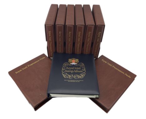 Queen Elizabeth II mint stamps in presentation packs and on album pages, many being low face value or non barcoded definitive