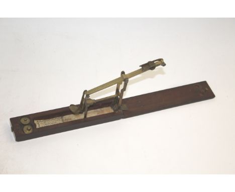 19THC CASED GUINEA SCALES - WILKINSON a mahogany cased set of brass Guinea scales and weights, with a paper label for Wilkins