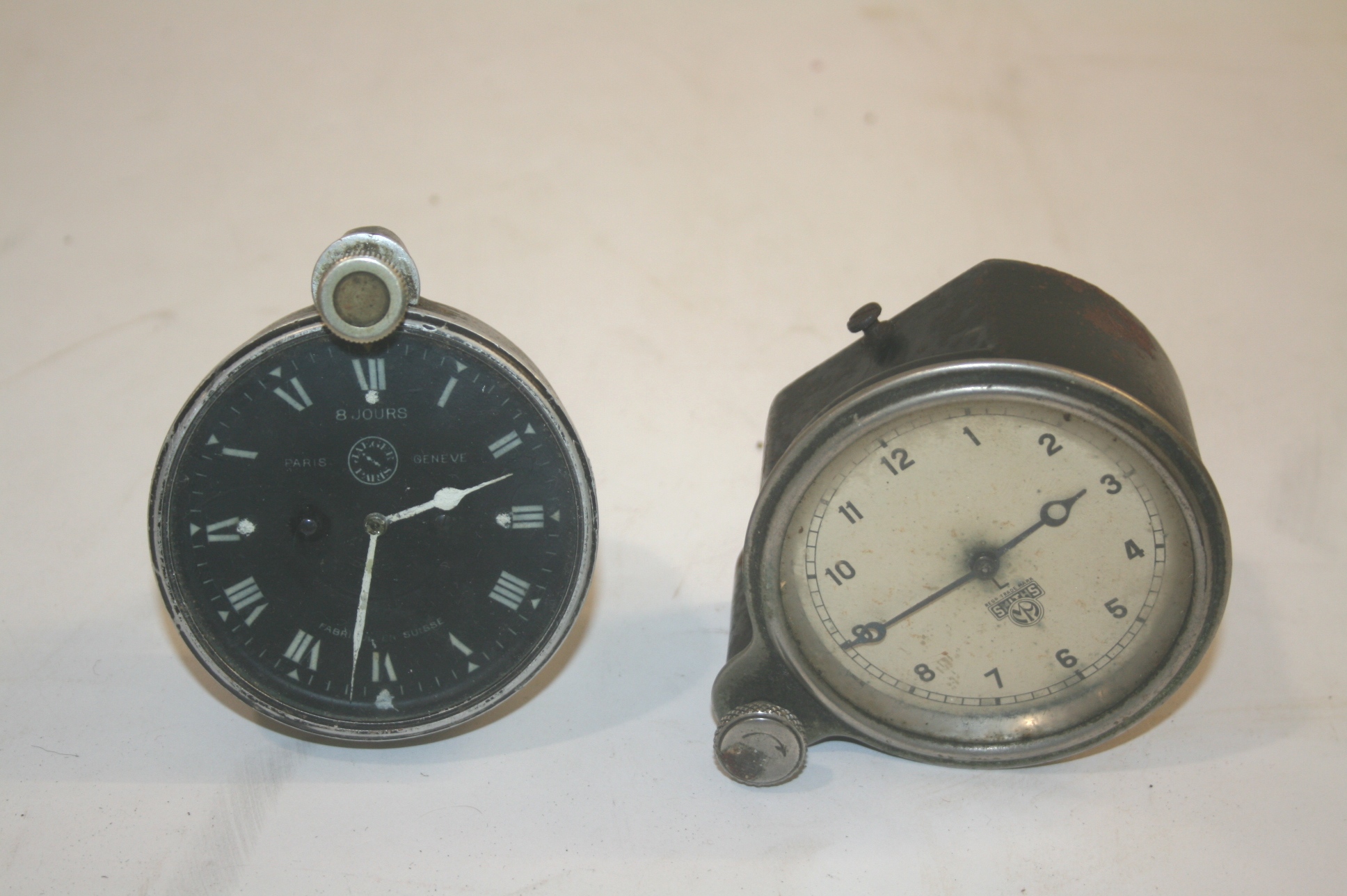 JAEGER VINTAGE CAR CLOCK PARIS a vintage car clock with a black dial