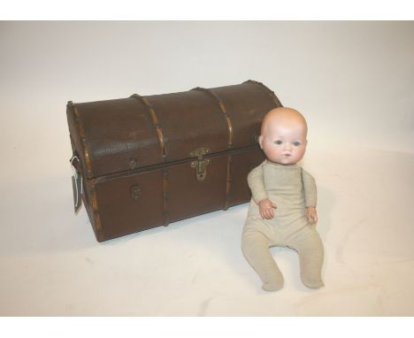 ARMAND MARSEILLE DOLL & DOLLS TRUNK the doll with weighted blue eyes and closed mouth. Also with a dome top dolls trunk with 