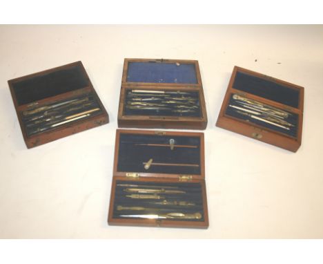 CASED GEOMETRY SETS 4 antique cased geometry sets, including a mahogany cased set with two layers, bone handles marked Elliot