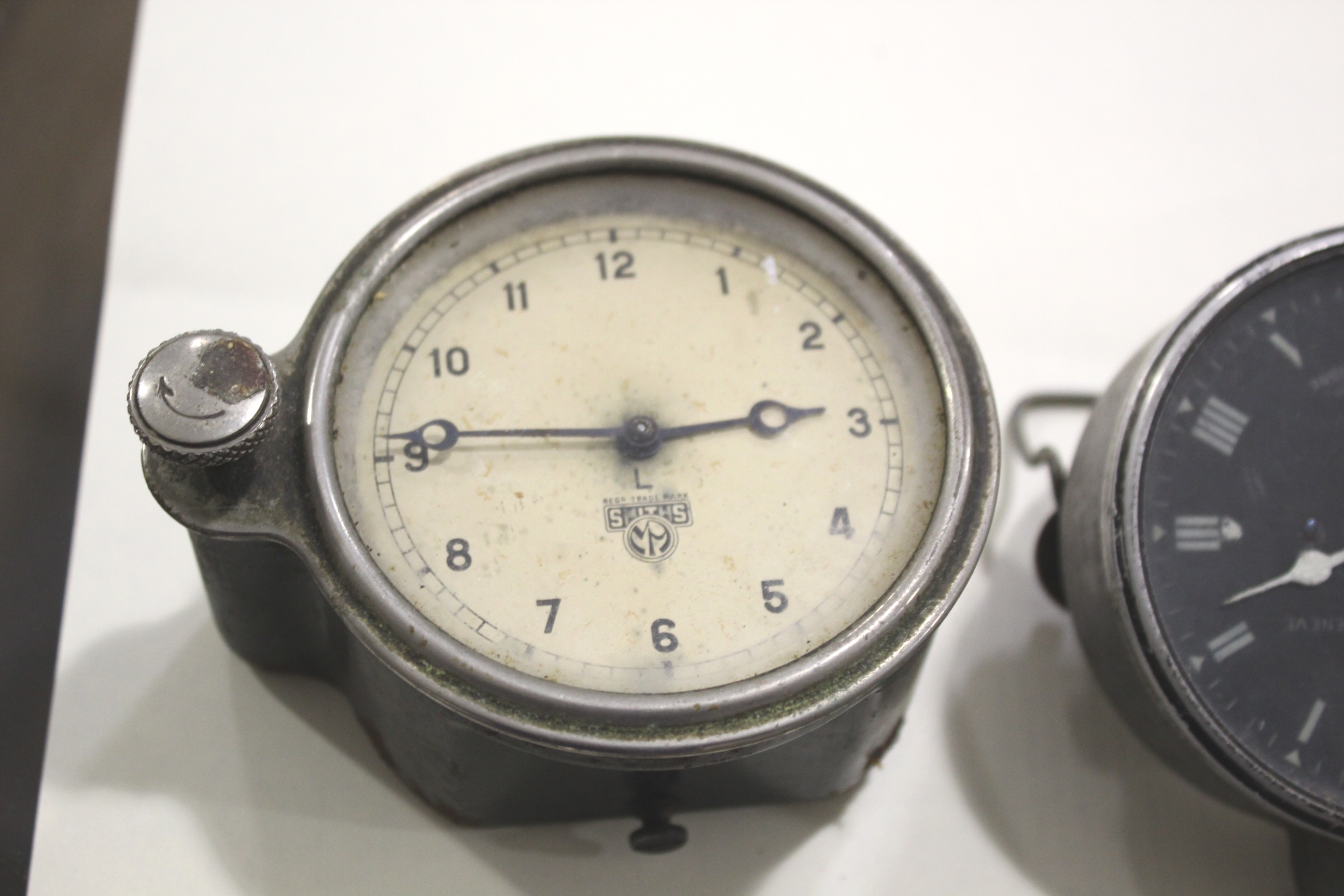 JAEGER VINTAGE CAR CLOCK PARIS a vintage car clock with a black dial