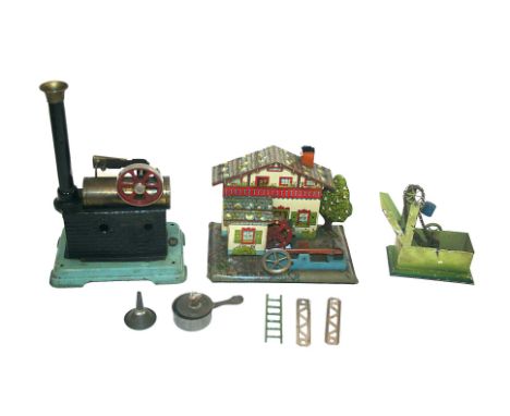 MODEL STEAM ENGINE a small model steam engine by DC, which can be attached to a German tin plate water wheel. Also with a fur