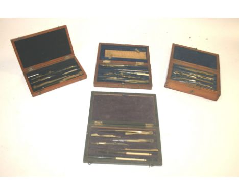 CASED GEOMETRY SETS 4 antique geometry sets, including one marked for Department of Art and Science, a set with two layers in