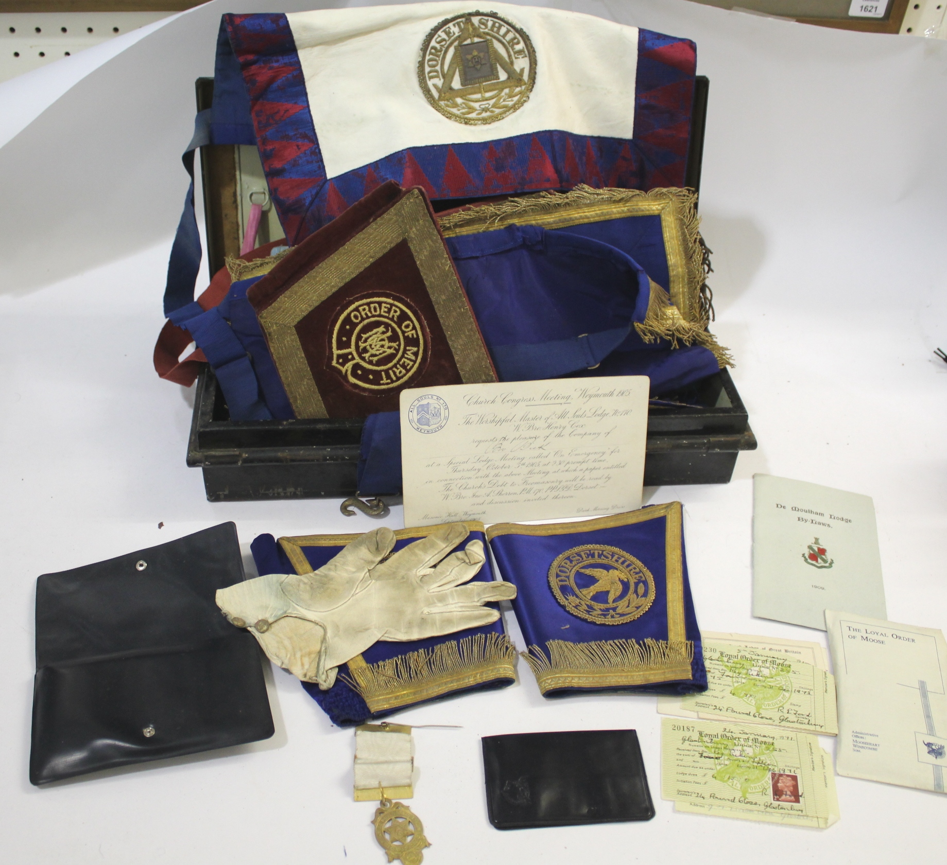 MASONIC ITEMS DORSET a variety of Masonic items contained in a metal tin, including aprons and