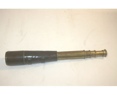 BRASS & LEATHER TELESCOPE by Broadhurst, Clarkson & Co, 63 Farrington Rd, London, a 4 drawer brass telescope with partial lea
