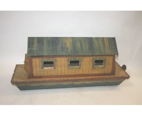 19THC NOAHS ARK probably German, made in pine and painted to the exterior. With a door on one end and a side panel which can 