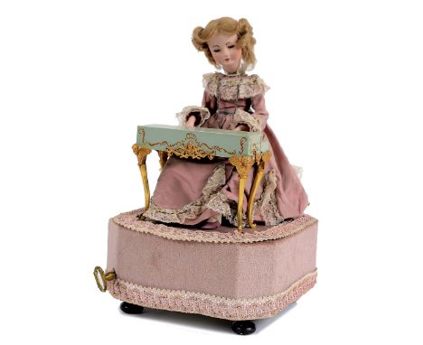 FRENCH BISQUE HEAD AUTOMATON - SWISS REUGE MOVEMENT possibly made in the 1970's, with a bisque head doll with composition han