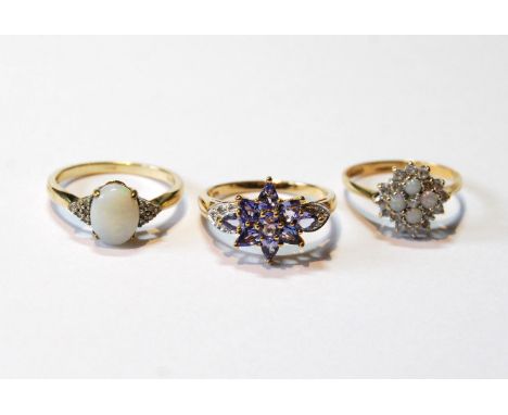 Opal cluster ring, another, and a tanzanite ring, all 9ct gold.&nbsp; (3) 