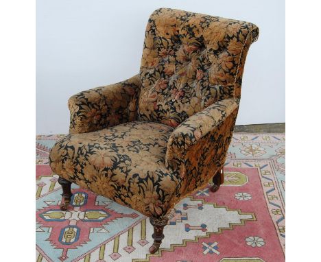 Victorian button-back armchair with cushioned arms, sprung seat, on tapering baluster legs terminating in ceramic castors, 66