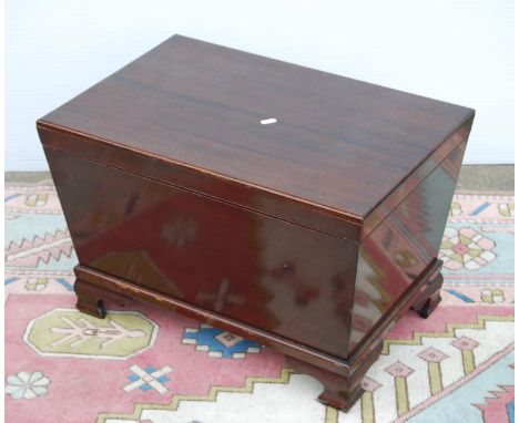 Mahogany cellarette by Irving &amp; Sons, Annan of rectangular casket form enclosing liner, on ogee bracket feet, 60cm wide, 