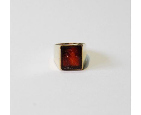 Gold signet ring with Arabic inscription on carnelian, probably 9ct, size I, 5.3g gross. 