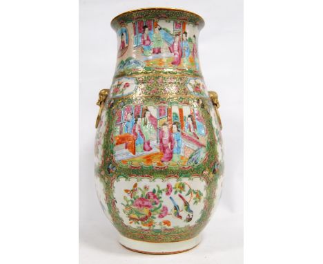 Canton famille verte vase decorated with panels depicting figures, blossom, butterflies and birds, gilt dragon mask handles, 