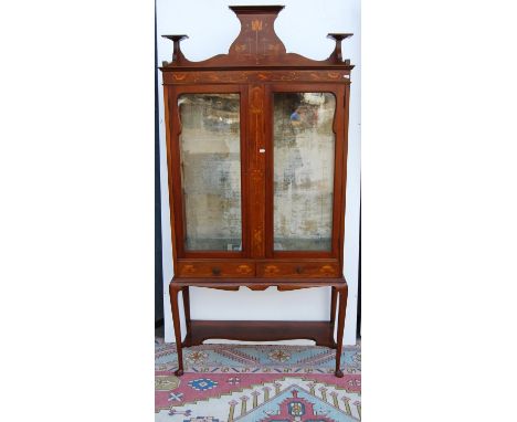 Art Nouveau mahogany and inlaid display cabinet, the shaped three-quarter gallery over central panel, glazed doors and side p