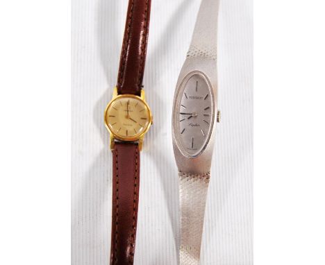 Lady's 14k white gold Tissot Saphir cocktail wristwatch, together with an Omega Genève wristwatch.  (2)CONDITION REPORT: The 