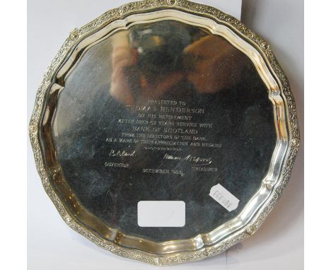 Silver circular waiter with shaped celtic border inscribed, '...1963', by Wakely and Wheeler, 1962, 21cm, 13oz. 