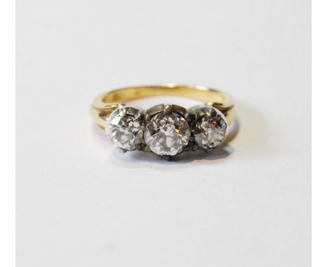 Antique diamond three-stone ring with old-cut brilliants, approximately .9ct and .6ct, in silver setting of Georgian style wi