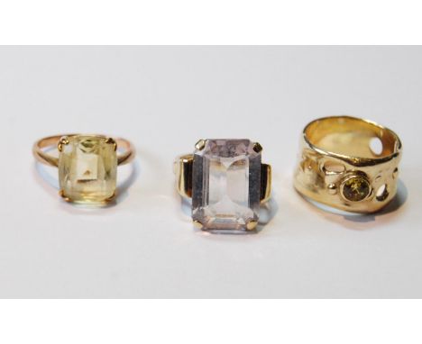 Gold pierced band ring with citrine and another two, all 9ct.CONDITION REPORT: The citrine ring is P½, the pierced band ring 