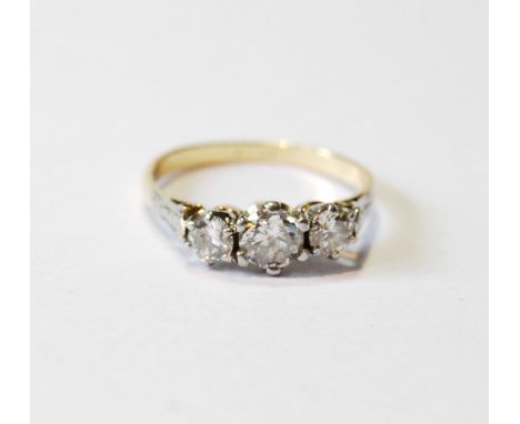 Diamond three-stone ring, the largest brilliant approximately .6ct, in gold, '18ct', size R.CONDITION REPORT: Colour K/L P1. 