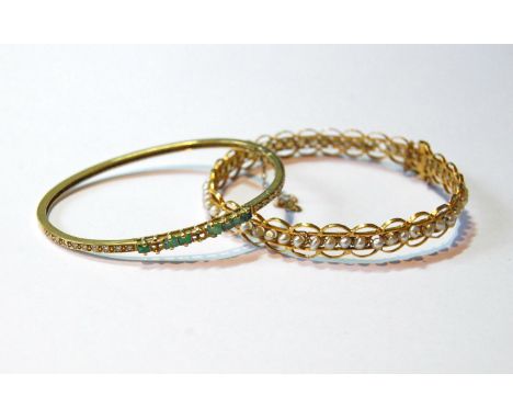 Indian gold bangle with pearls and another with diamonds and emeralds, gross 20g.&nbsp; (2) 