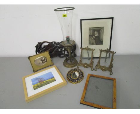 A mixed lot to include a mid 20th century brass storm lamp, brass frames, a wood carving, pictures and frames 