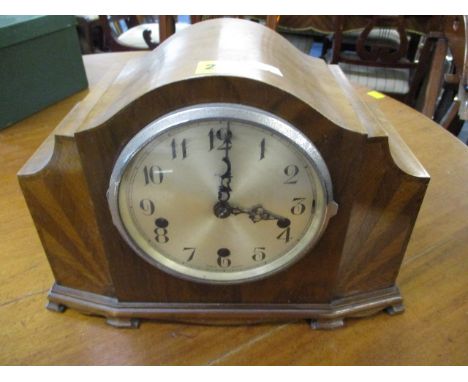 An early 20th century walnut cased mantle clock 