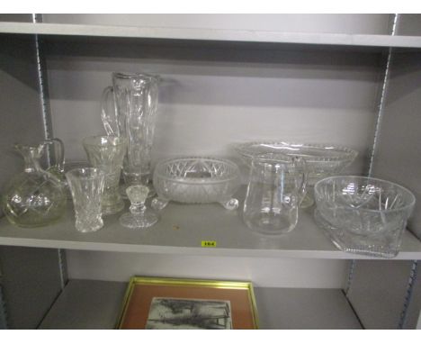 A selection of early 20th century cut glassware to include a large jug, a candlestick, bowls and other items 