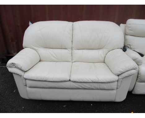 A modern cream leather two seater sofa 