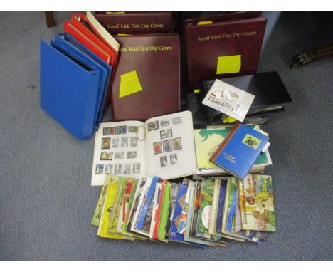 A large quantity of first day covers, cigarette cards and stamps from around the world