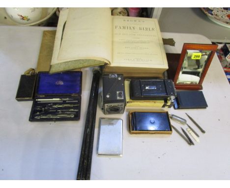 A mixed lot to include cameras, a cased geometry set, a folding mahogany mirror, propelling pencils, Rev John Brown family bi