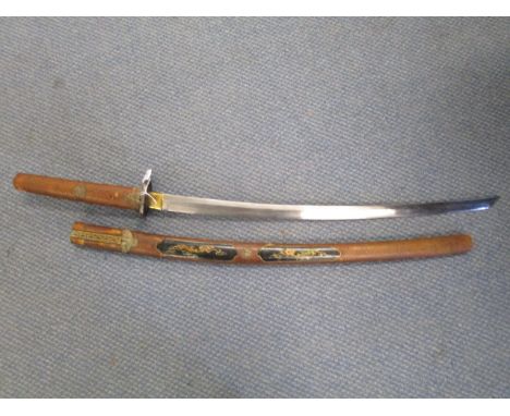 A late 19th/early 20th century Japanese sword, curved blade with steel Tsuba, decorated with a seated animal and foliage in l