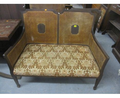 An early 20th century Bergere sofa and matching armchair 