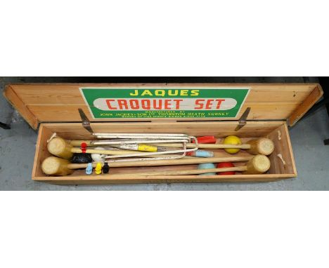 A JOHN JACQUES AND SON LIMITED CROQUET SET, COMPRISING FOUR MALLETS, SIX WHITE PAINTED IRONS, HOOPS, BALLS AND STICK, IN MAKE