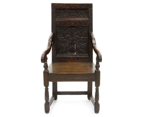 A CHARLES II STYLE OAK PANELLED BACK ARMCHAIR, INLAID IN HOLLY AND BOG OAK, SEAT HEIGHT 46CM Back panel split, seat replaced,