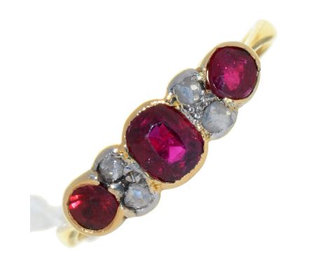 A RUBY AND DIAMOND RING, IN GOLD, 2.4G, SIZE R Wear to settings and hoop. Slight wear to facets of rubies when examined under