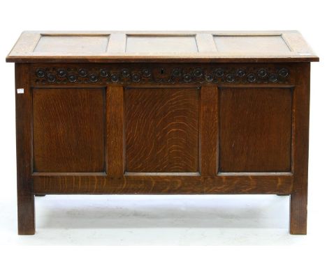 A VICTORIAN OAK THREE PANEL CHEST WITH CARVED FRIEZE, 58CM H; 112 X 50CM Some marks and fading to lid, otherwise good, solid 