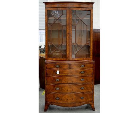 A GEORGE III STYLE BURR WALNUT BOW FRONTED SECRETAIRE BOOKCASE ON SPLAYED BRACKET FEET, 220CM H; 100 X 55CM One catch on secr