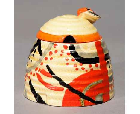 CLARICE CLIFF. AN A J WILKINSON CARPET BEE SKEP HONEY JAR AND A COVER, 1930, 9CM H, PRINTED BIZARRE MARK Jar - fine descendin
