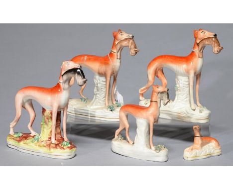 FIVE STAFFORDSHIRE EARTHENWARE MODELS OF GREYHOUNDS, MID 19TH C, THE FOUR LARGER WITH HARE, 19CM H AND SMALLER Smallest model