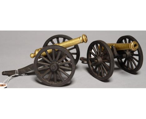 A PAIR OF BRASS MODEL&nbsp; CANNON, ON IRON CARRIAGE, BARREL 13CM L Good condition